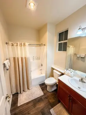 a bathroom with a toilet and a shower and a sink at Marina Del Rey Sunrise - Pool & Gym & Sauna & Cinema in Marina del Rey