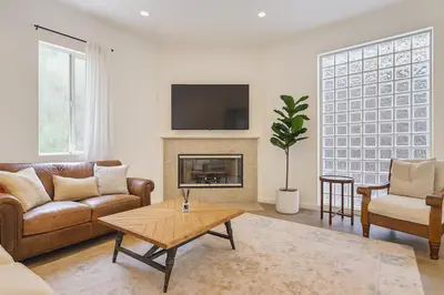a living room with a couch and a fireplace at Malibu Woods & Waves - 2 Bedroom in Malibu