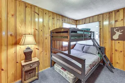 a bedroom with a bunk bed in a cabin at Swim, Ski and Explore Cabin in Green Valley Lake! in Green Valley Lake