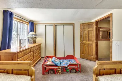 a childs bedroom with a red toy truck in it at Swim, Ski and Explore Cabin in Green Valley Lake! in Green Valley Lake