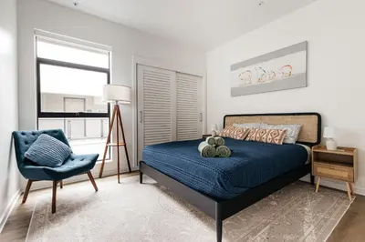 a bedroom with a blue bed and a blue chair at Superior 2 bedroom apartment in Heart of Hollywood in Los Angeles