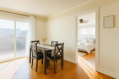 a dining room with a table and chairs and a bedroom at Fullerton Fairytale Vacation Home - 10 Min Drive to Disneyland in Fullerton