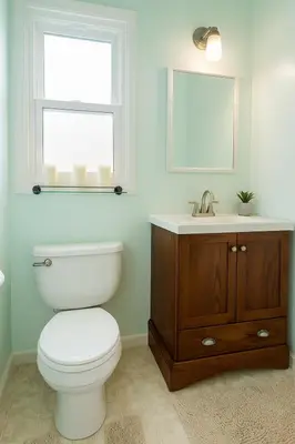 a bathroom with a toilet and a sink and a window at Fullerton Fairytale Vacation Home - 10 Min Drive to Disneyland in Fullerton