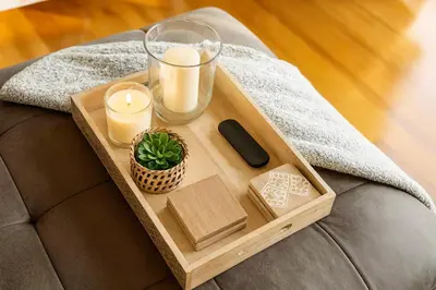 a tray with candles and a remote control on a couch at Fullerton Disneyland Getaway - 4BR in Fullerton