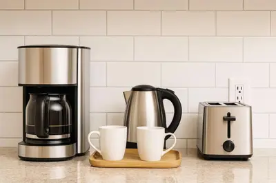 a coffee maker and two coffee cups on a counter at Fullerton Disneyland Getaway - 4BR in Fullerton