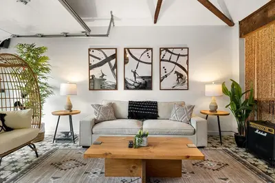 a living room with a couch and a coffee table at Hip Venice Beach Luxury Airstream & Creative Space in Los Angeles
