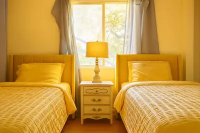 two beds in a bedroom with a window at Malibu Beach - Nature 2BR Retreat in Malibu