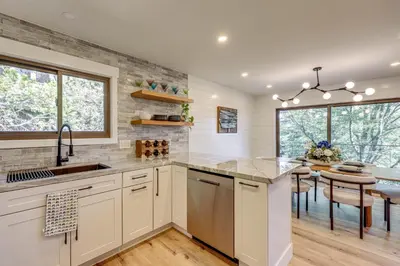 a kitchen with a sink and a counter top at Stunning Forest Views Luxury Lake Arrowhead Cabin in Lake Arrowhead