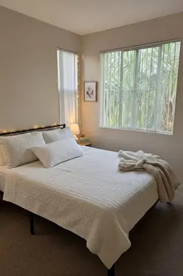 a bedroom with a large bed with a window at Marina Del Rey Luxe 2-Bedroom & 1-Bedroom - Hot Tub, Pool Table, Grill & Cinema Projector in Marina del Rey