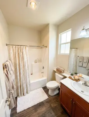 a bathroom with a toilet and a tub and a sink at Sunny Marina Del Rey Apartment- Hot Tub, Game Room, BBQ, Projector in Los Angeles