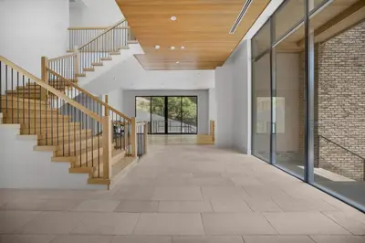 an open hallway with stairs and a brick wall at Bowmont in Los Angeles