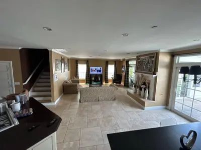 a large living room with a couch and a fireplace at Private room private balcony shared bathroom - Mini Mansion in Burbank