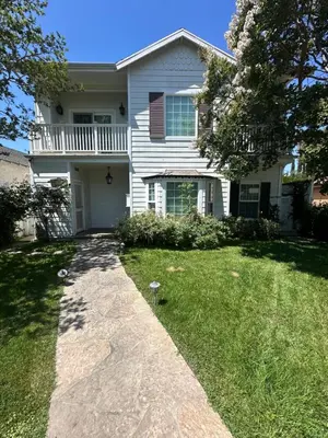 a white house with a walkway in the yard at Private room private balcony shared bathroom - Mini Mansion in Burbank