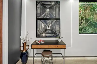 a desk in a room with a picture on the wall at Venice House w Pool Spa Home Theater Rooftop in Los Angeles