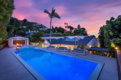 a swimming pool with chairs and a house at Sunset Strip 5 Star Location w Pool Jacuzzi Cabana BBQ in Los Angeles