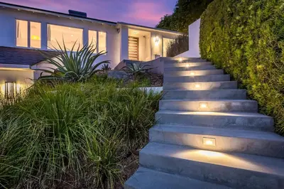a set of stairs leading to a house with lights at Sunset Strip 5 Star Location w Pool Jacuzzi Cabana BBQ in Los Angeles