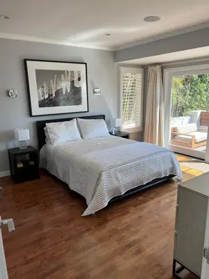 a bedroom with a large bed and a large window at Sunset Strip 5 Star Location w Pool Jacuzzi Cabana BBQ in Los Angeles