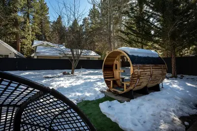 a sauna in a yard with snow on the ground at Summit Haven: Game Room | Sauna | Spa | 1/4 Acre in Big Bear Lake