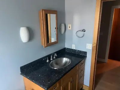 a bathroom with a sink and a mirror at Private room in guest house - Mini Mansion in Burbank