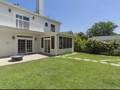 a large white house with a lawn in front of it at Private room in guest house - Mini Mansion in Burbank