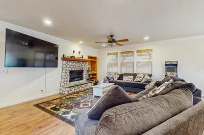 a living room with a couch and a fireplace at Walk to Lake Arrowhead! Family Home with Games in Lake Arrowhead