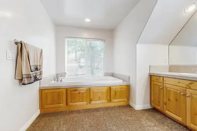 a bathroom with a sink and a window at Walk to Lake Arrowhead! Family Home with Games in Lake Arrowhead