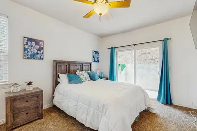 a bedroom with a bed and a ceiling fan at Walk to Lake Arrowhead! Family Home with Games in Lake Arrowhead