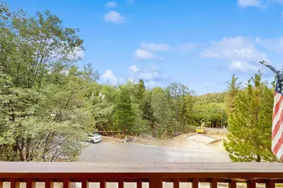 a view of a parking lot from a deck at Walk to Lake Arrowhead! Family Home with Games in Lake Arrowhead