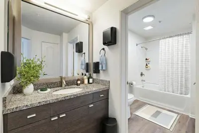 a bathroom with a sink and a large mirror at Beachside Marina Del Rey 2BR & 1BR - Resort Amenities in Los Angeles