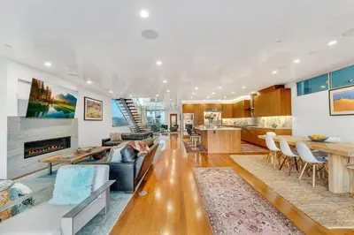 a living room with a couch and a table at ocean front beach house in Oxnard