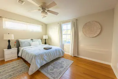 a bedroom with a bed and a ceiling fan at Fullerton Family-Ready- 9 min to Disneyland in Fullerton