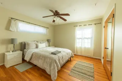 a bedroom with a bed and a ceiling fan at Fullerton Adventure Pad - 10 min to Disneyland in Fullerton