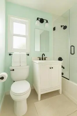 a white bathroom with a toilet and a sink at Fullerton Adventure Pad - 10 min to Disneyland in Fullerton