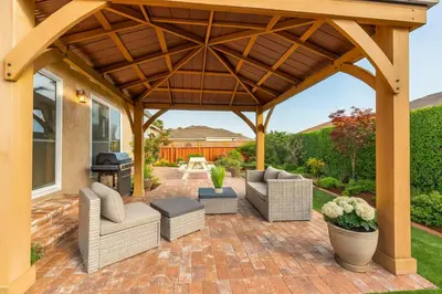 a pavilion with couches and a grill on a brick patio at Fullerton Parkside Getaway - 13min to Disneyland in Fullerton
