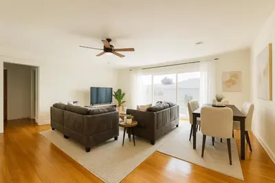 a living room with two couches and a table at Fullerton Parkside Getaway - 13min to Disneyland in Fullerton