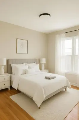 a white bedroom with a large white bed and a window at Fullerton Parkside Getaway - 13min to Disneyland in Fullerton