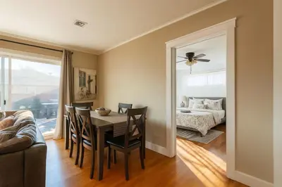 a dining room with a table and chairs and a bed at 4BR Fullerton Retreat - Private Backyard in Fullerton