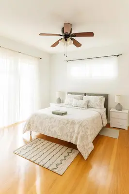 a bedroom with a bed and a ceiling fan at 4BR Fullerton Retreat - Private Backyard in Fullerton