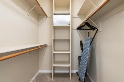 a walk in closet with shelves and a ladder at Serene Zen Peaceful Zen Garden View with Pool Gym in Los Angeles