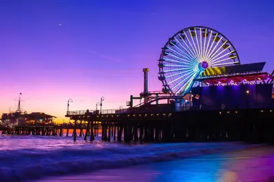 a pier with a ferris wheel on the beach at Serene Zen Peaceful Zen Garden View with Pool Gym in Los Angeles