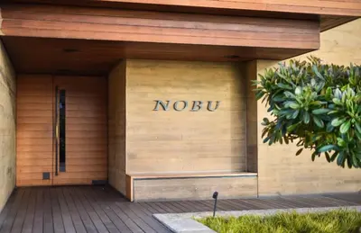 a nobu sign on the side of a building at Oceanfront, Pool, Jacuzzi NO HWY Noise! in Malibu Beach