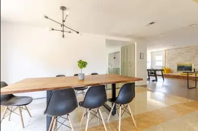a dining room with a wooden table and chairs at CA1 Fun And Central Home with Sauna in La Palma