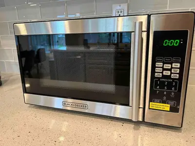 a microwave oven sitting on top of a counter at CA1 Fun And Central Home with Sauna in La Palma