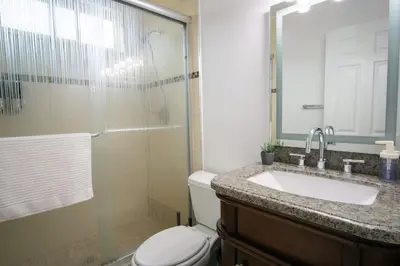 a bathroom with a toilet and a sink and a shower at CA1 Fun And Central Home with Sauna in La Palma