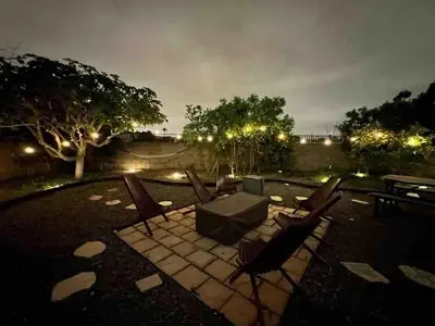 a patio with chairs and a table at night at CA1 Fun And Central Home with Sauna in La Palma