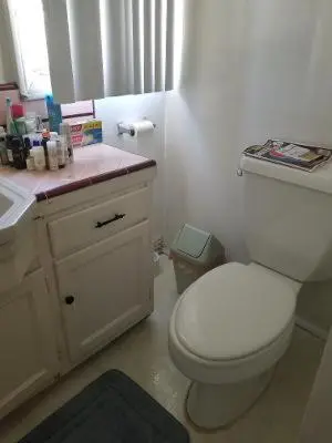 a bathroom with a white toilet and a sink at Beautiful apartment close to Cedars! Beverly Hills in Los Angeles