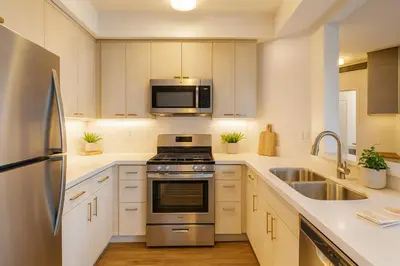a kitchen with a stainless steel stove and a microwave at Marina Del Rey Getaway - Resort Amenities in Marina del Rey in Los Angeles