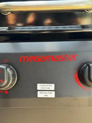 a microwave with the word meenamaster on it at The Maze House Pool Theatre Room in San Bernardino
