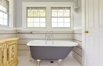 a bath tub in a white bathroom with windows at Luxe Homestay in Hollywood - by The Grove & Walk of Fame in Los Angeles
