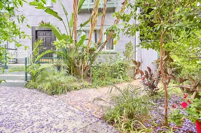 a house with a door and plants in front of it at Luxe Homestay in Hollywood - by The Grove & Walk of Fame in Los Angeles